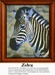 A zebra in profile stands against a soft background, with clearly defined black and white stripes, perfect for this cross stitch design.