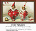 Two children in Valentine costumes play in a room with toys and a dog, yours as a counted cross stitch kit.
