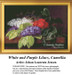 A table displays vibrant sprays of lilacs and camellia flowers, offered as a counted cross stitch pattern by Johan Laurentz Jensen.