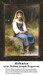 A young girl in peasant clothing sits pensively on a stone marked "1885," yours as a counted cross stitch kit.