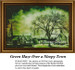 A town with a green haze envelops its buildings and trees, brought to life as a counted cross stitch pattern.