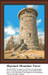 Haystack Mountain Tower stands tall against a bright blue sky, shown as a downloadable pattern by Sunrays Creations for cross stitch enthusiasts.