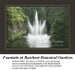 A fountain erupts in a star-like formation of water amidst dark emerald trees, yours as a counted cross stitch kit.