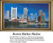 A large cross stitch pattern of the Boston Harbor skyline featuring tall buildings and historic docks in the foreground, stitched on Aida cloth.