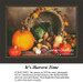 A cornucopia filled with pumpkins, gourds, and vegetables sits on a table, accompanied by autumn leaves, in this Thanksgiving PDF pattern.