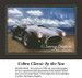 A Cobra Classic parked on a sandy beach beneath a blue sky with fluffy clouds, designed as a counted cross stitch chart for enthusiasts.
