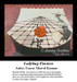 A ladybug and various insects play instruments on a large spider web, designed as a counted cross stitch pattern waiting as your next cross stitch.