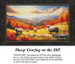 A flock of sheep grazes on a hillside with vibrant trees and mountains in the background, featured in a counted cross stitch kit.