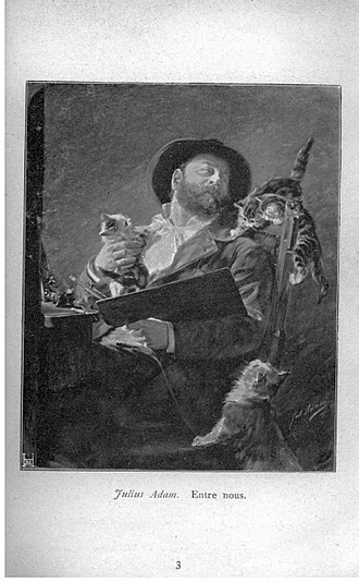 An oil painting self-portrait of artist Julius Adam. He is shown sitting with a palette and paintbrush, wearing a dark smock and a black cap. Three cats are featured in the composition: one perched on his shoulder, one in his lap, and one at his feet. The painting has a warm, intimate atmosphere with soft lighting, showcasing the artist's close bond with his famous feline subjects.