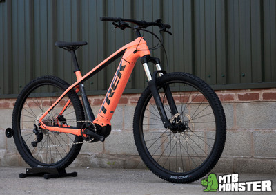 Check out that stunning Coral colour way... Trek Powerfly 4! - MTB Monster