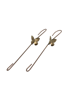 Set of two handcrafted decorative hooks with brass butterfly accents, copper finish.