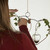 Plant cuttings being placed into double heart hanging vase