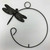 Close-up of decorative dragonfly on crescent hanging vase