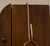 Copper-coated S hook hanging from cabinet rail