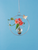 Round hanging plant vase with flowers against blue background