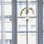 Round hanging plant vase displayed in a window with trailing greenery