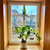 Dimensional Diamond hanging glass vase in window with plant cuttings