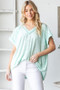 Heimish Full Size Exposed Seam V-Neck Short Sleeve Leopard Top Plus Size