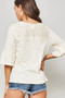 A Knit Top With Deep V Neckline And Yoke Design​