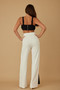 X Ribbon Open Jumpsuit​​