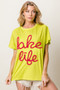 BiBi Metallic Letter Short Dolman Sleeve Top