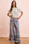 BiBi Washed Floral Denim With Ruffle Elastic Wide Pants