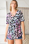 Heimish Full Size Crisscross Neck Animal Print Babydoll Top Plus Size
