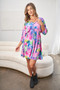 White Birch Full Size Printed V-Neck Tie Back Mini Dress