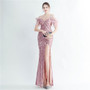 Positioning sequin feather straps off shoulder formal party evening dress