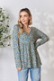 Heimish Full Size Floral Half Button Long Sleeve Blouse