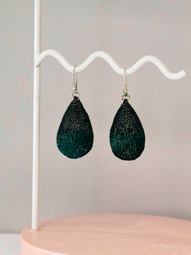 Crafted with delicate wire crochet work in oxidised silver-plated wire and featuring a half-green colour, these earrings exude a modern and elegant feel. The sterling silver hooks not only provide comfort but also ensure quality and durability.