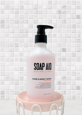 A close-up view of the Soap Aid Body Wash label, clearly showing the product details and mission statement, emphasising its not-for-profit status and commitment to global hygiene