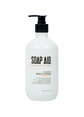 A clear, front-facing product shot of the white Soap Aid Body Lotion pump bottle. The label prominently displays the 'Soap Aid' logo and product name, highlighting its ethical focus A clear, front-facing product shot of the white Soap Aid Body Lotion pump bottle. The label prominently displays the 'Soap Aid' logo and product name, highlighting its ethical focus