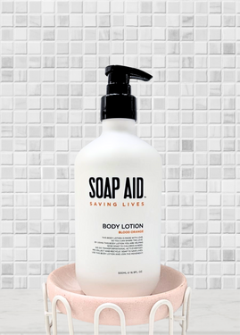 A close-up view of the Soap Aid Body Lotion label, clearly showing the product details and mission statement, emphasising its not-for-profit status and humanitarian purpose A close-up view of the Soap Aid Body Lotion label, clearly showing the product details and mission statement, emphasising its not-for-profit status and humanitarian purpose