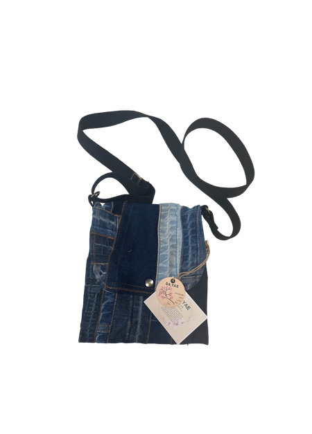 Upcycled denim crossbody bag with a snap, casual eco friendly bag for women made from recycled denim.