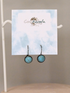 Earrings adorned in turquoise stone, connecting the wearer with the energy of the Earth.