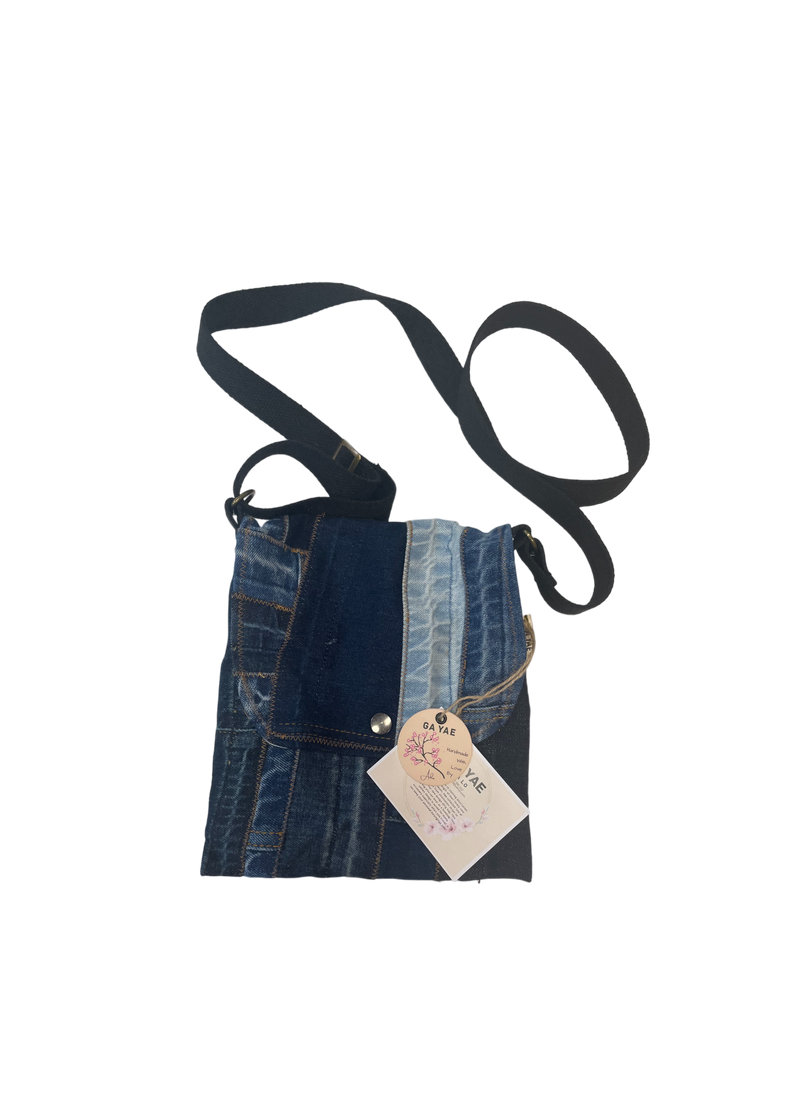 Small upcycled denim crossbody bag with a snap, casual eco friendly bag for women made from recycled denim.