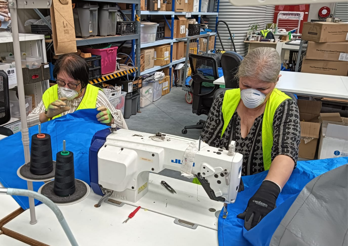 SisterWorks team sewing upcycled tarpaulin products
