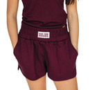 Scarlet & Gold Texas A&M maroon women’s athletic shorts featuring a white Gig ’Em Aggies patch on the elastic waistband and side pockets.