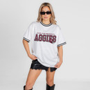 White Gameday Couture Texas A&M mesh jersey tee featuring maroon Aggies lettering, a football helmet graphic, black striped trim, breathable perforated fabric, and Texas A&M lettering with number 12 on the back.