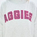 Scarlet & Gold Texas A&M Aggies oversized grey crewneck sweatshirt featuring bold gingham Aggies lettering across the chest