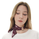 ZooZatz Texas A&M maroon satin skinny scarf featuring repeating white A&M logos, gray rope graphics, and a silver-tone twisted ring, shown styled around the neck and tied at the wrist.