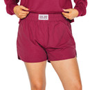 Scarlet & Gold maroon nylon shorts featuring an elastic waistband, curved side hems, relaxed fit, and a small white “Gig ’Em Aggies” label centered along the front waistband.
