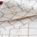 Poncho Texas A&M Aggies white short sleeve button down shirt with multicolor grid pattern and chest logo.