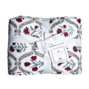 Ida Mae twin size quilt featuring a white background with maroon and red floral patterns, green leafy accents, decorative black details, and a soft quilted design tied with a white ribbon.