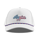Branded Bills white Texas A&M cap featuring patriotic script Aggies lettering with red, white, and blue stars and stripes, a structured crown, curved bill, and coordinating multicolor rope detail.