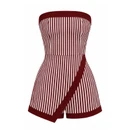 Maroon and white vertically striped strapless romper featuring a fitted bodice, smocked back, maroon trim, shorts, and an asymmetrical wrap-style front panel for a skirt-like look.