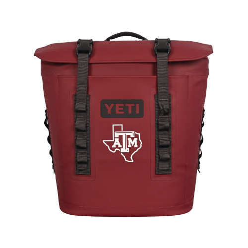 YETI Texas A&M Aggies maroon backpack cooler with shoulder straps, top handle, and Texas A&M logo on the front.