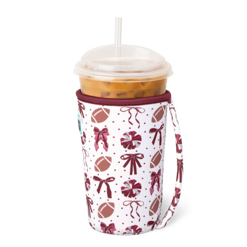 Swig Life Texas A&M Aggies cup coolie with handle featuring maroon bow and football pattern designed to fit reusable cups