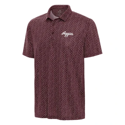 Antigua maroon Texas A&M floral polo featuring a small allover white floral-inspired print, short sleeves, classic collar, button placket, and white embroidered Aggies script on the chest.